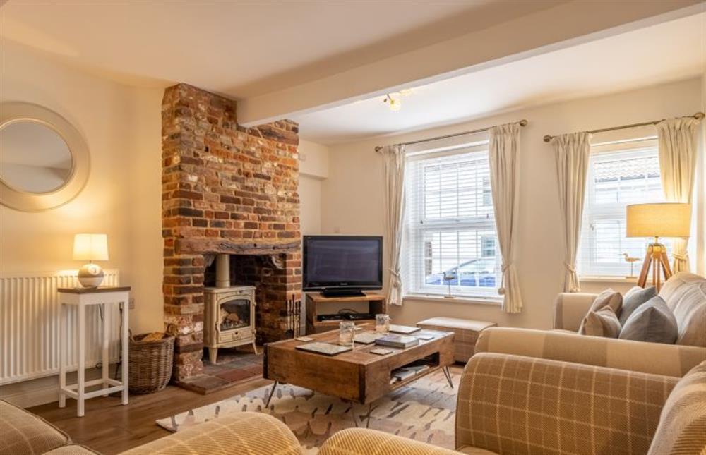 Coxswainfts House: The sitting room has a wood burning stove at Coxswains House, Wells-next-the-Sea