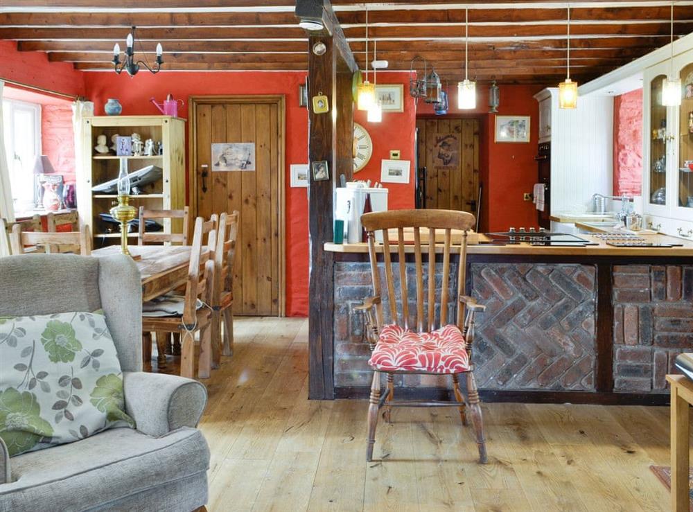 Characterful open plan living space at Barn Cottage, 