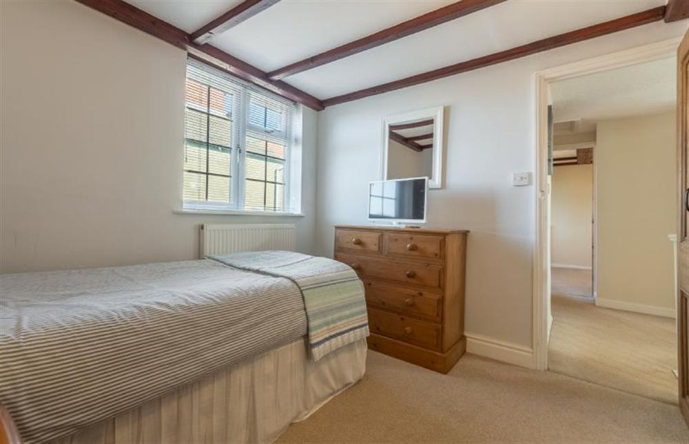 First floor: Bedroom three with 3ft twin beds (photo 3) at Crabpot Cottage, East Runton near Cromer