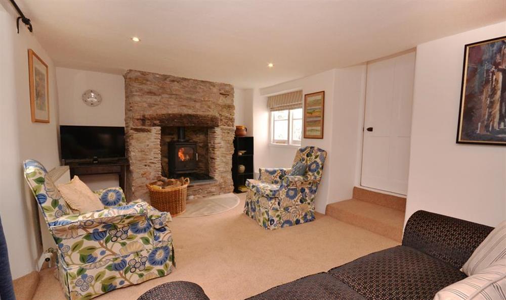 The fireplace with woodburner at Cracklefield Cottage, Bantham