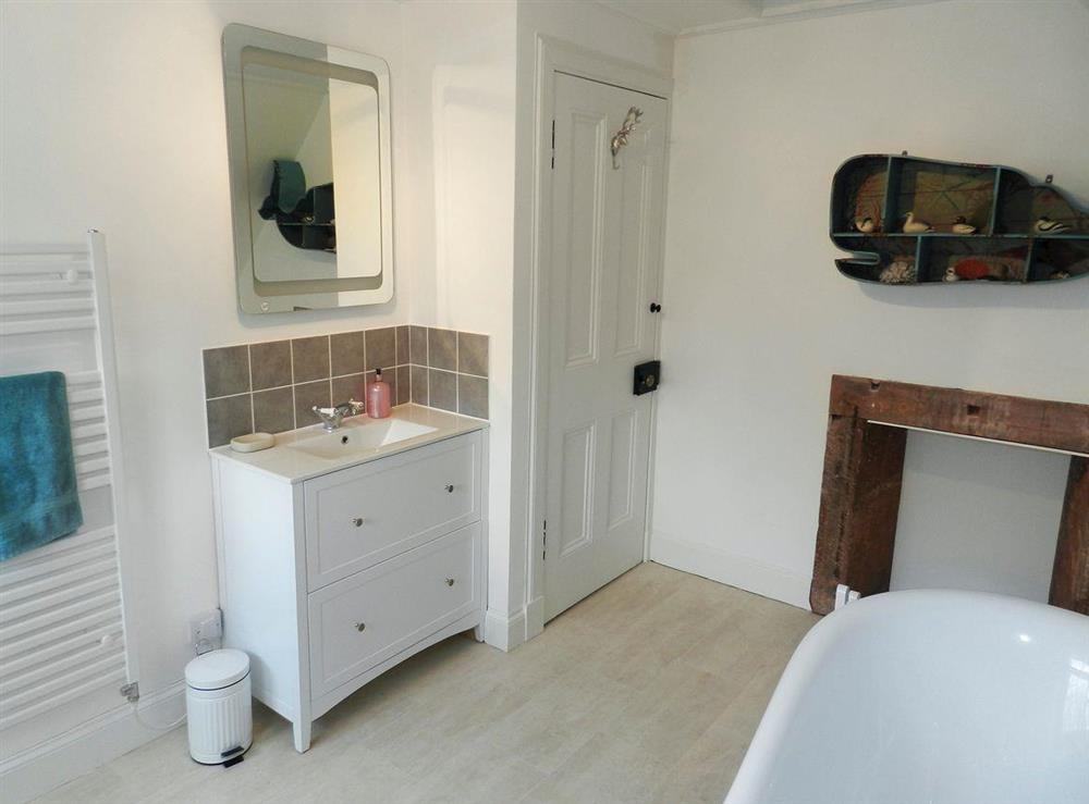 Bathroom with roll-top bath at Craegard House in Corrie, Isle of Arran, Scotland