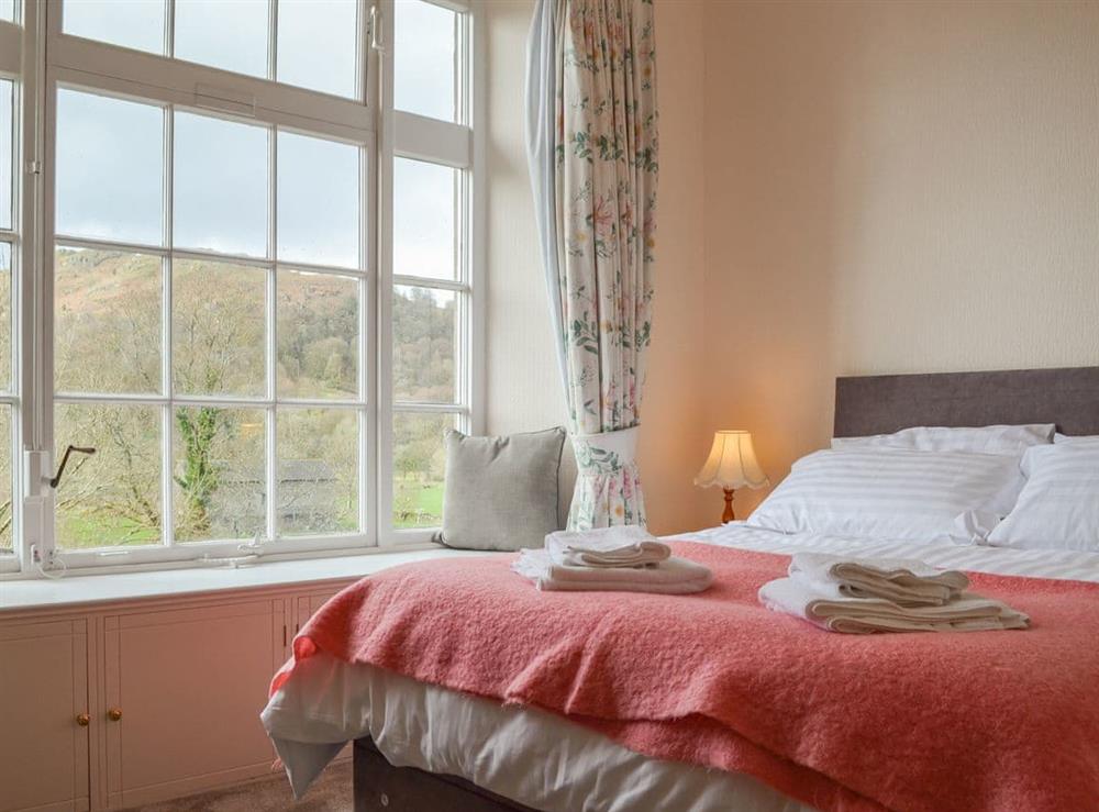 Master bedroom with king bed and beautiful view at Crag View in Ambleside, Cumbria