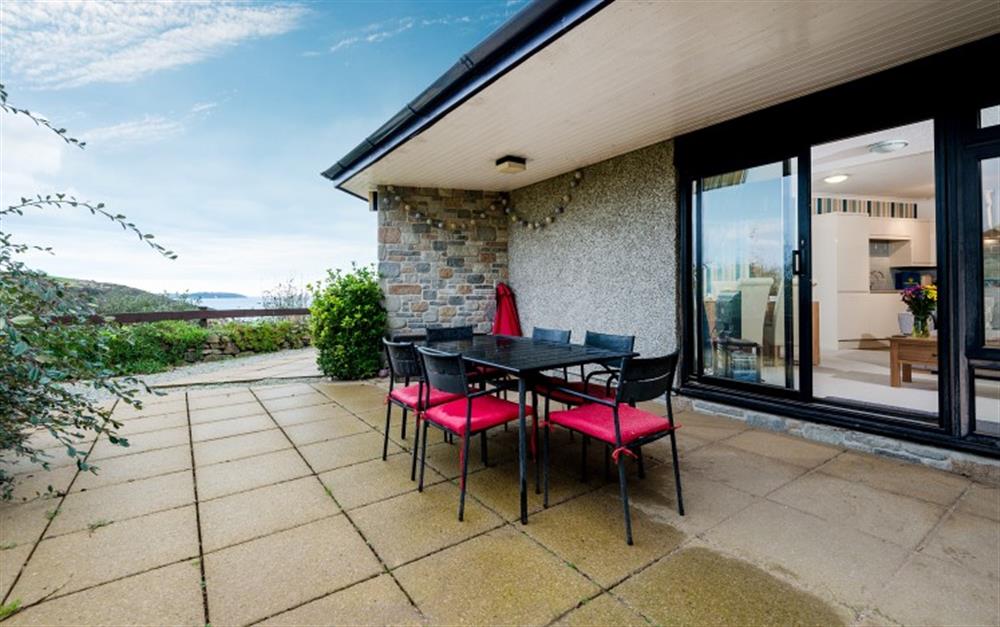 One terrace area, accessed through the living room. Here you'll find garden furniture for six. A perfect spot for an early evening supper. at Crags 14 in Maenporth