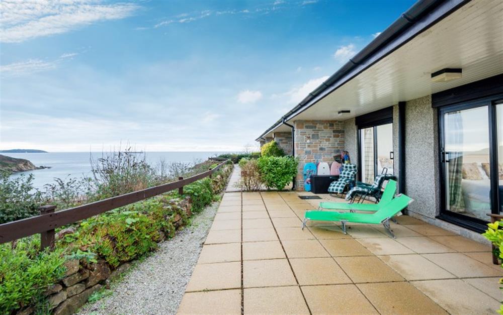 You'll find sun loungers on the terrace outside the bedrooms, plus gorgeous views across the cove. at Crags 14 in Maenporth
