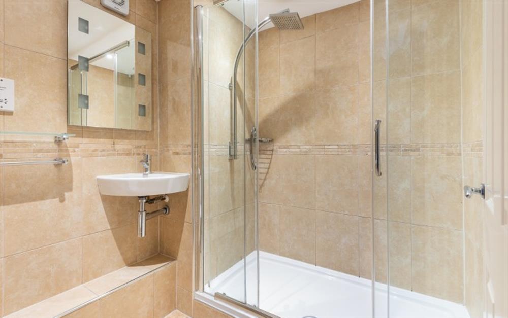 The stylish shower room is located on the ground floor. at Crags 26 Bay View Cottage in Maenporth