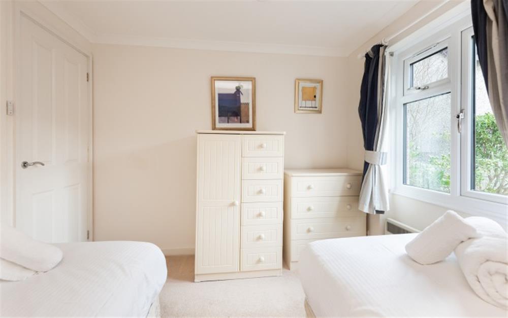 View of the master bedroom from the ensuite bathroom at Crags 26 Bay View Cottage in Maenporth