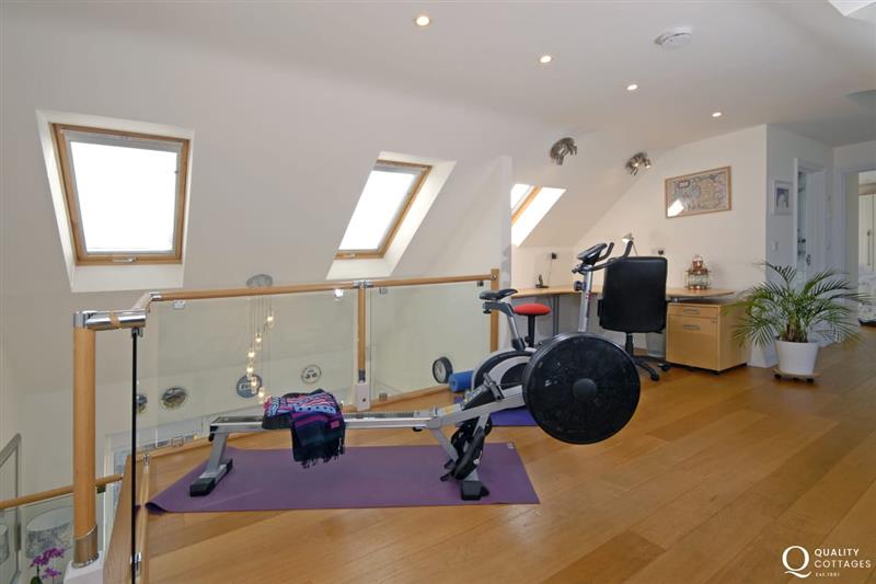 Gallery with gym kit and office area at Craig Silian, Gwbert