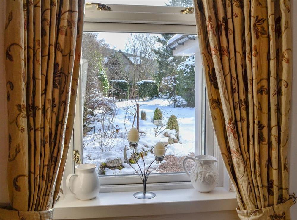 Fine view of the garden from the living room at Craigclunie in Ballater, Aberdeenshire
