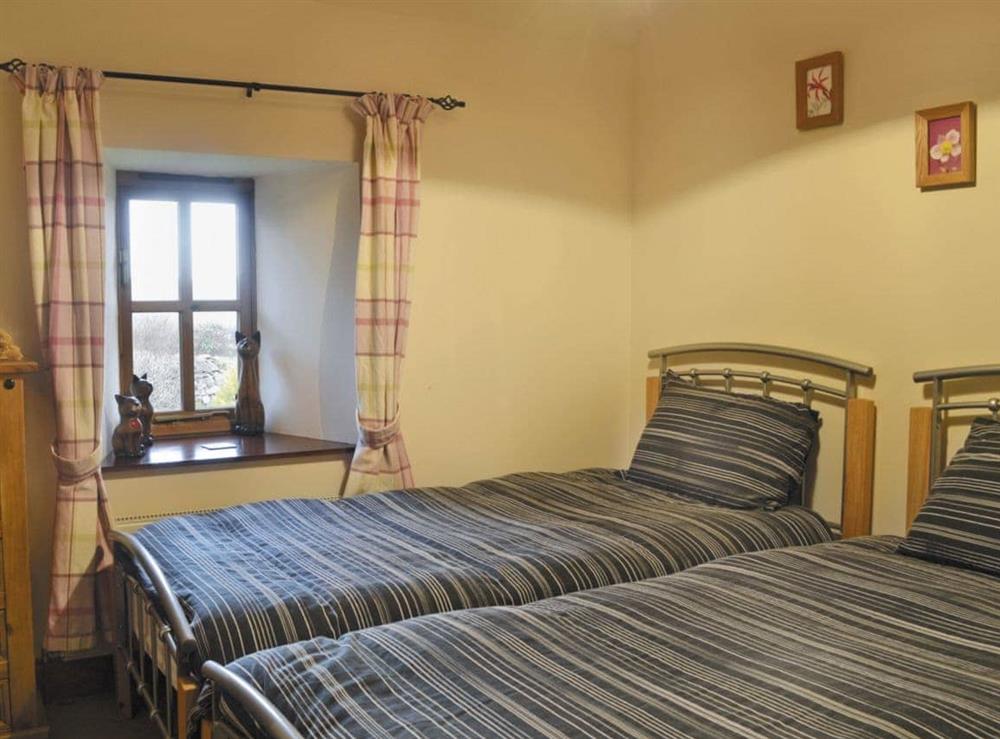 Cosy twin bedroom at Craigellachie Cottage in Wester Galcantray, near Cawdor, Morayshire