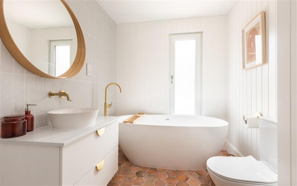 Family bathroom with freestanding bath and separate walk in shower at Craiglands in Salcombe