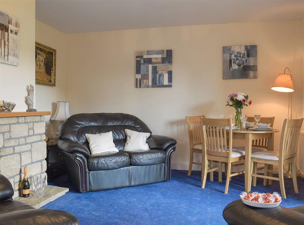 Comfortable living/ dining room at Craigrossie Cottage in Auchterarder, Perthshire