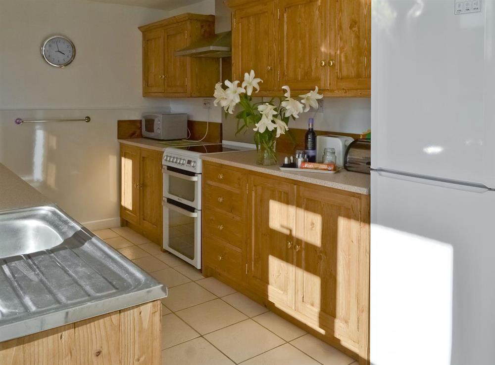 Galley style kitchen at Craneham Farmhouse in Bideford, Devon