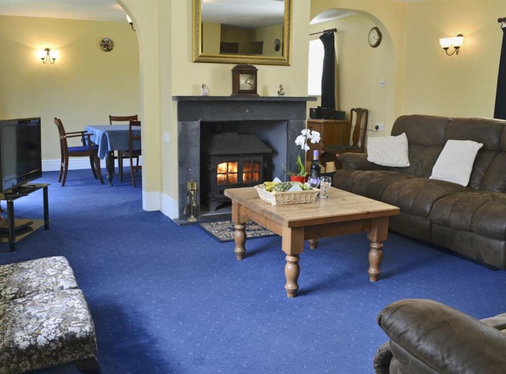 Warm and toasty living room at Craneham Farmhouse in Bideford, Devon
