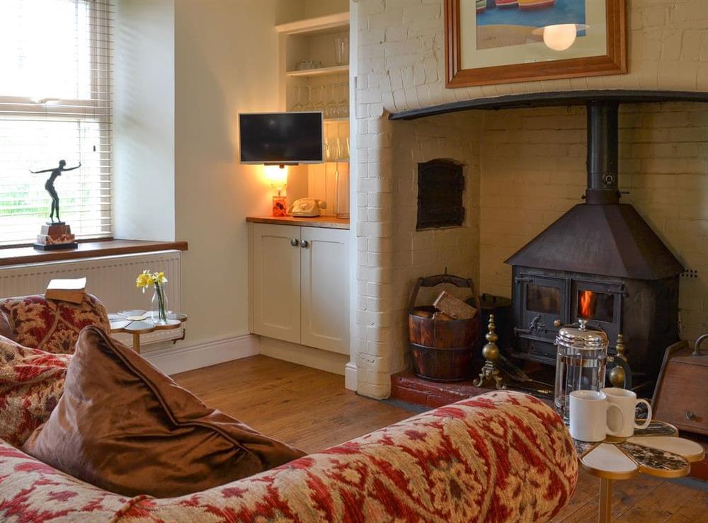 Cosy sitting area with woodburner at Cranford House in Cranford, near Clovelly, Devon