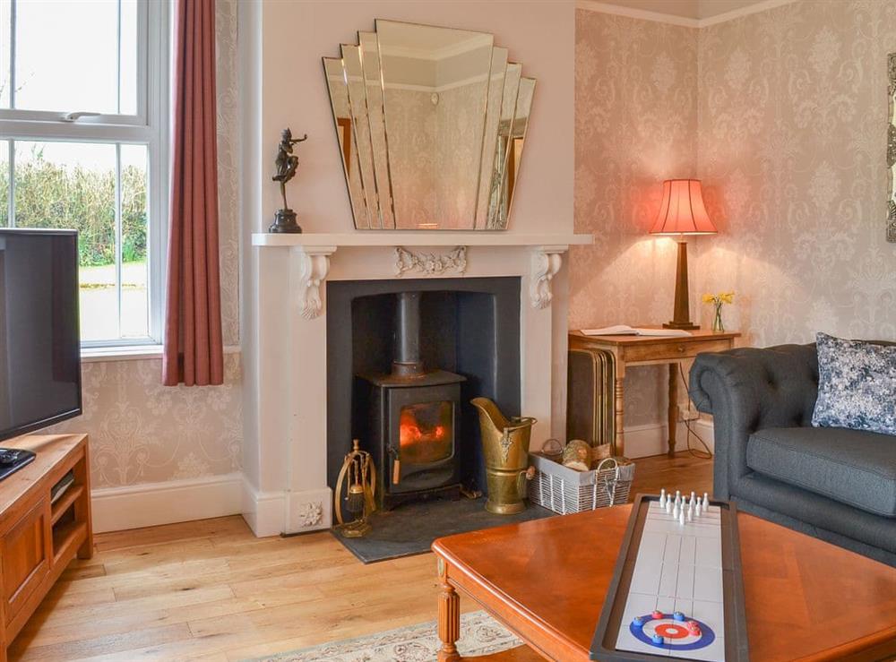 Lovely living room with wood burner at Cranford House in Cranford, near Clovelly, Devon