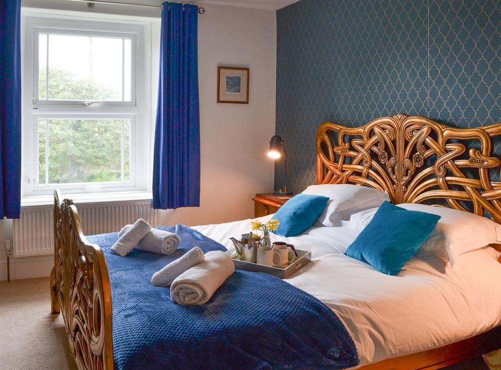 Spectacular bedroom with super kingsize bed at Cranford House in Cranford, near Clovelly, Devon