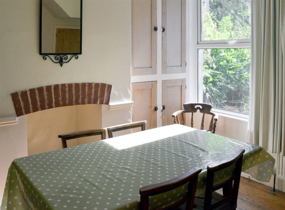 Dining room with access to the kitchen at Cranmere in Salcombe, Devon