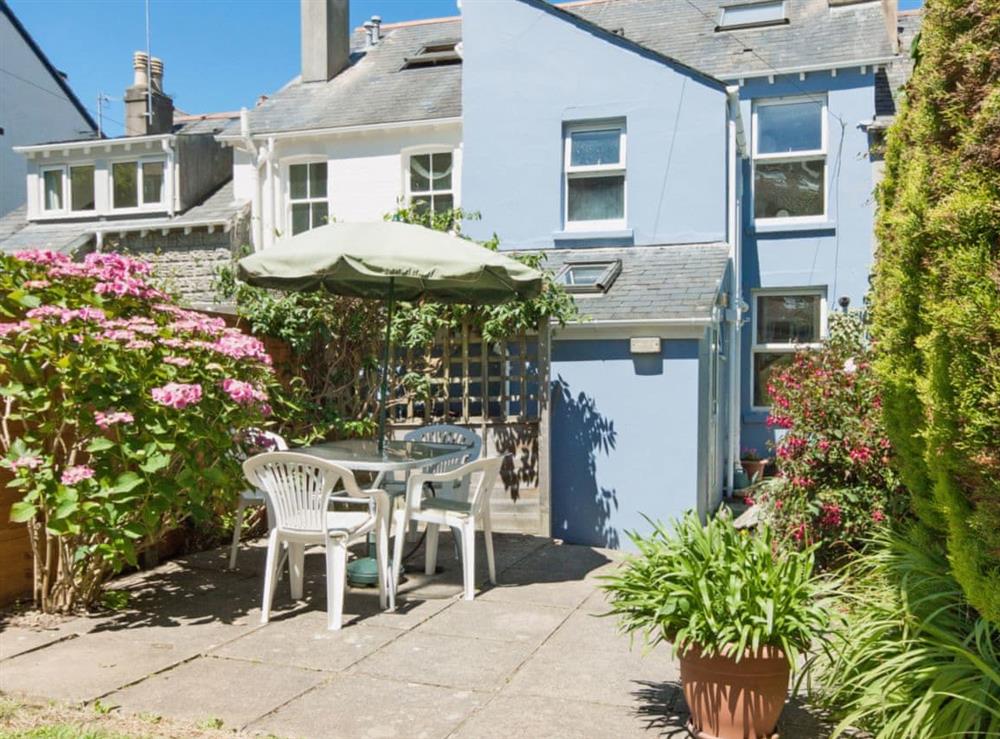Sunny patio and lawn at Cranmere in Salcombe, Devon