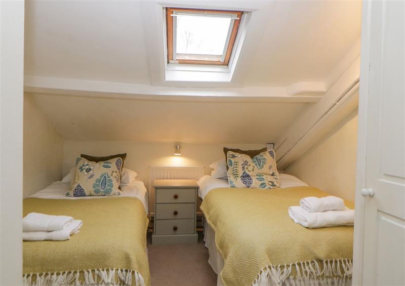 A bedroom in Crannacombe Farmhouse at Crannacombe Farmhouse, Loddiswell