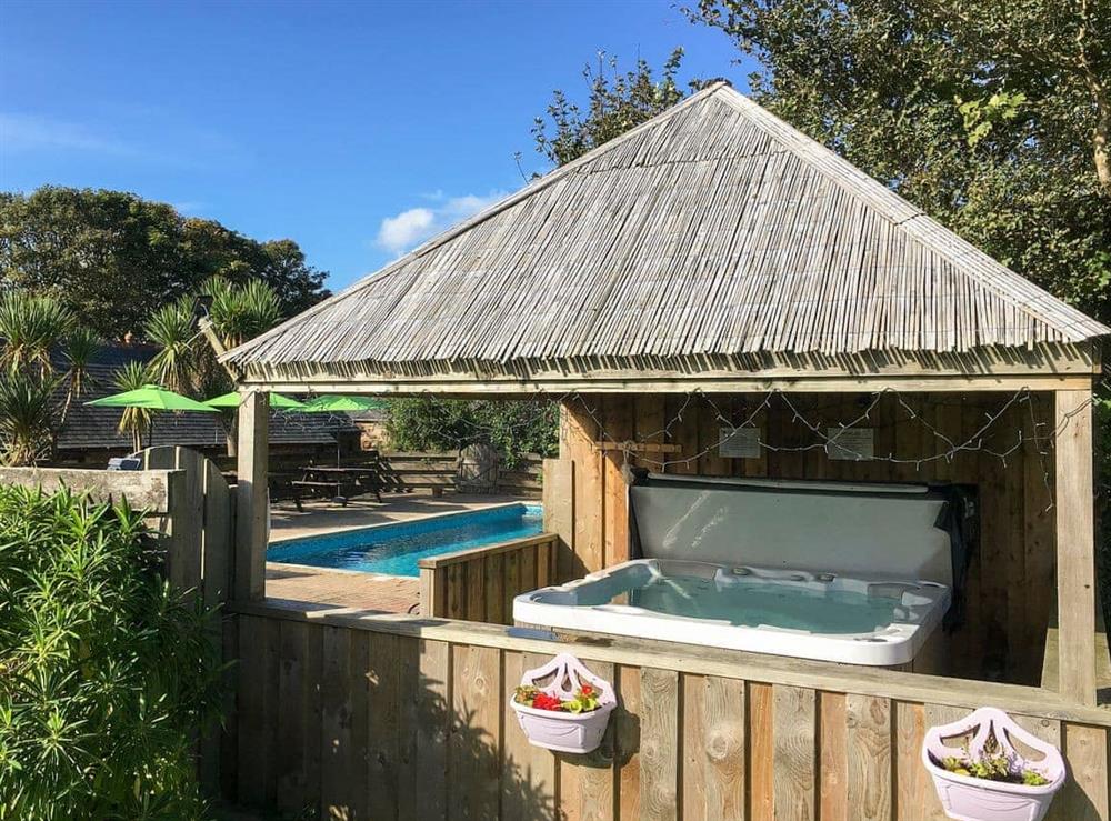 Shared hot tub at Crantock Cottage in Goonhavern, near Newquay, Cornwall