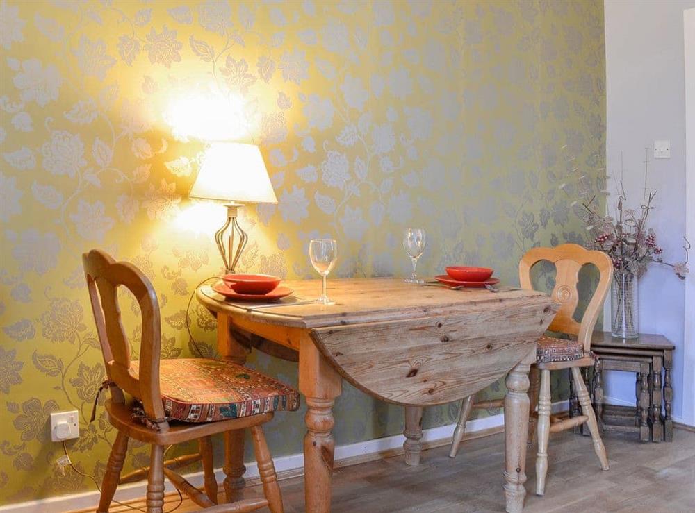 Compact dining area with gorgeous table and chairs at Craven Cottage in Skipton, North Yorkshire