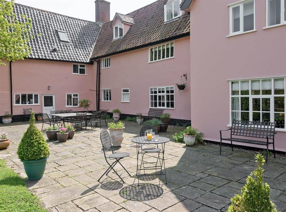 Spacious terrace with outdoor seating at Cravens Manor in Henham, near Southwold, Suffolk