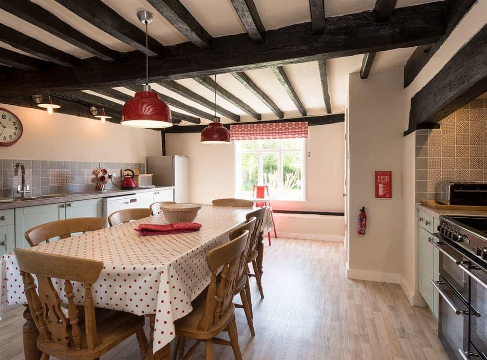 Traditional farmhouse kitchen/dining area with electric range (photo 2) at Cravens Manor in Henham, near Southwold, Suffolk