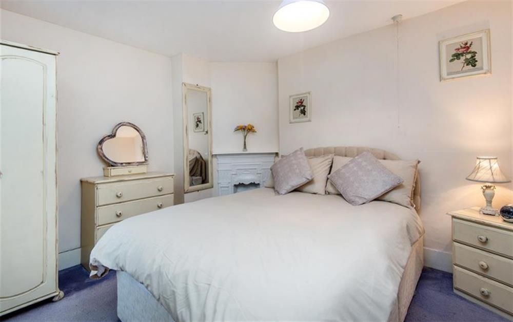 Double bedroom with ensuite shower room at Crays Cottage in Lyme Regis