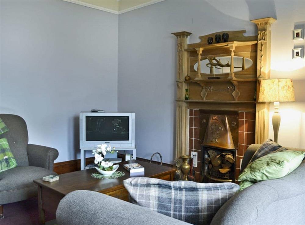 Tastefully furnished living room with open fire (photo 2) at Creag Darach Cottage in Aberfoyle, near Callander, Stirlingshire, Scotland