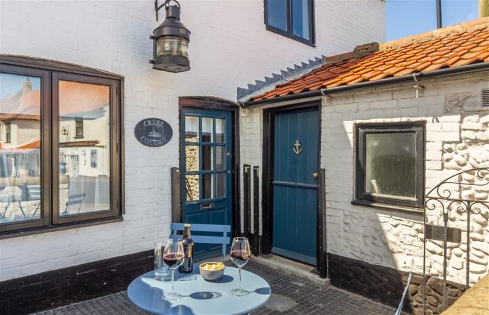Catch the morning sun in the courtyard at Creek Cottage, Wells-next-the-Sea