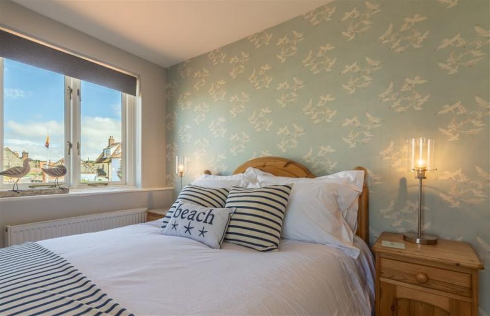 First floor: Master bedroom with double bed at Creek Cottage, Wells-next-the-Sea