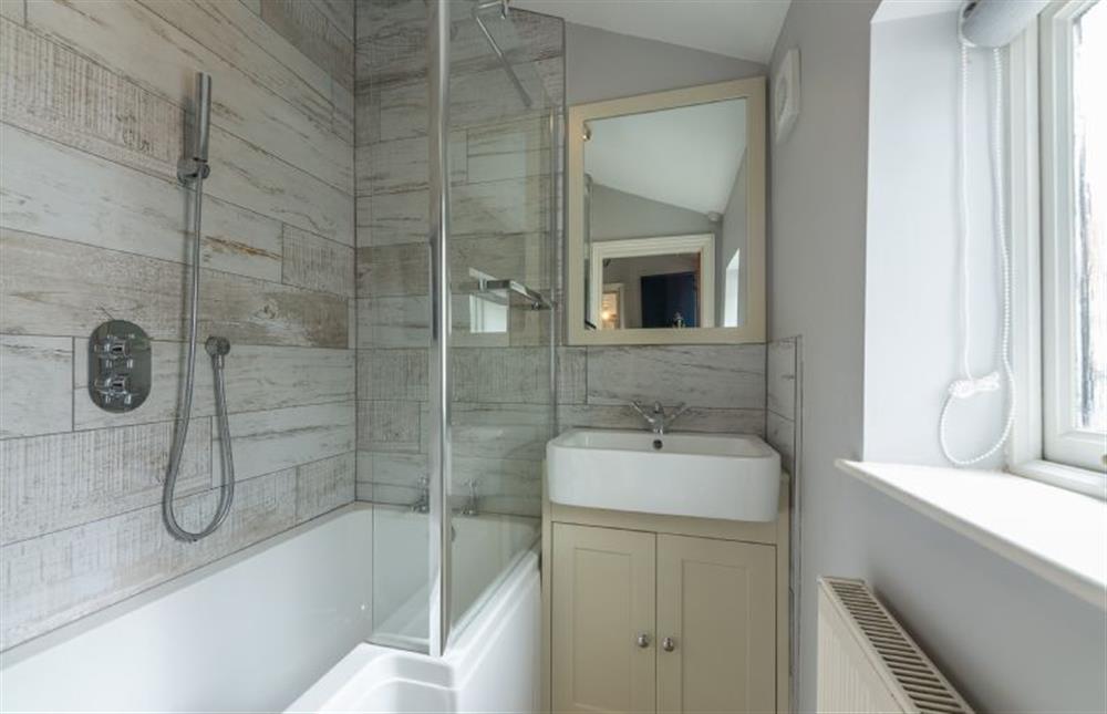 Ground floor: Bathroom with shower over bath at Creek Cottage, Wells-next-the-Sea