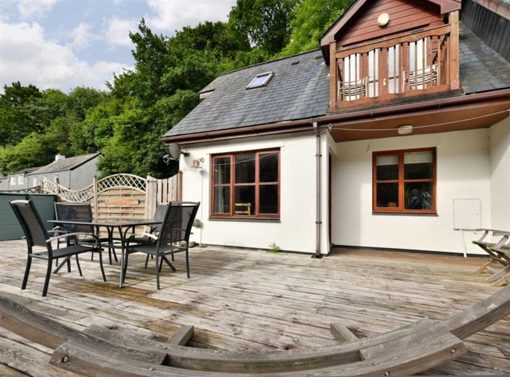 Decked patio with outdoor furniture at Creekside in Wadebridge, near Padstow, Cornwall