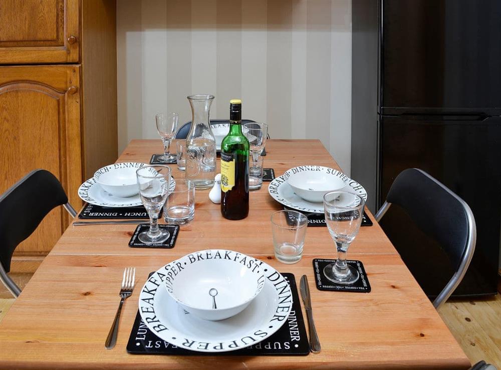 Enjoy a family meal in the lovely kitchen/diner at Creel Cottage in Auchmithie, near Arbroath, Angus