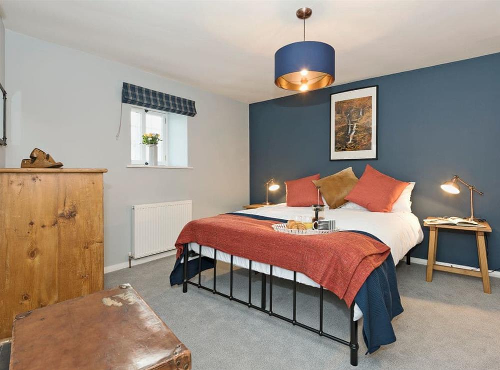 Charmingly furnished double bedroom with  kingsize bed at Crescent Cottage in Lowther, near Penrith, Cumbria