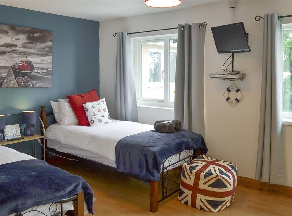 Good-sized twin bedroom at Crew House in Craster, near Alnwick, Northumberland