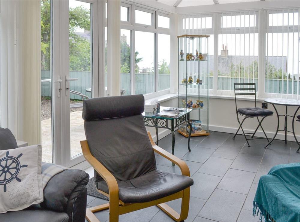 Light and airy conservatory at Crew House in Craster, near Alnwick, Northumberland