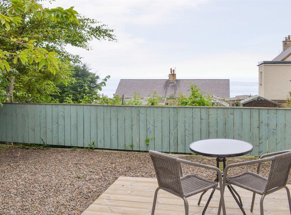 Patio area with views towards the sea at Crew House in Craster, near Alnwick, Northumberland
