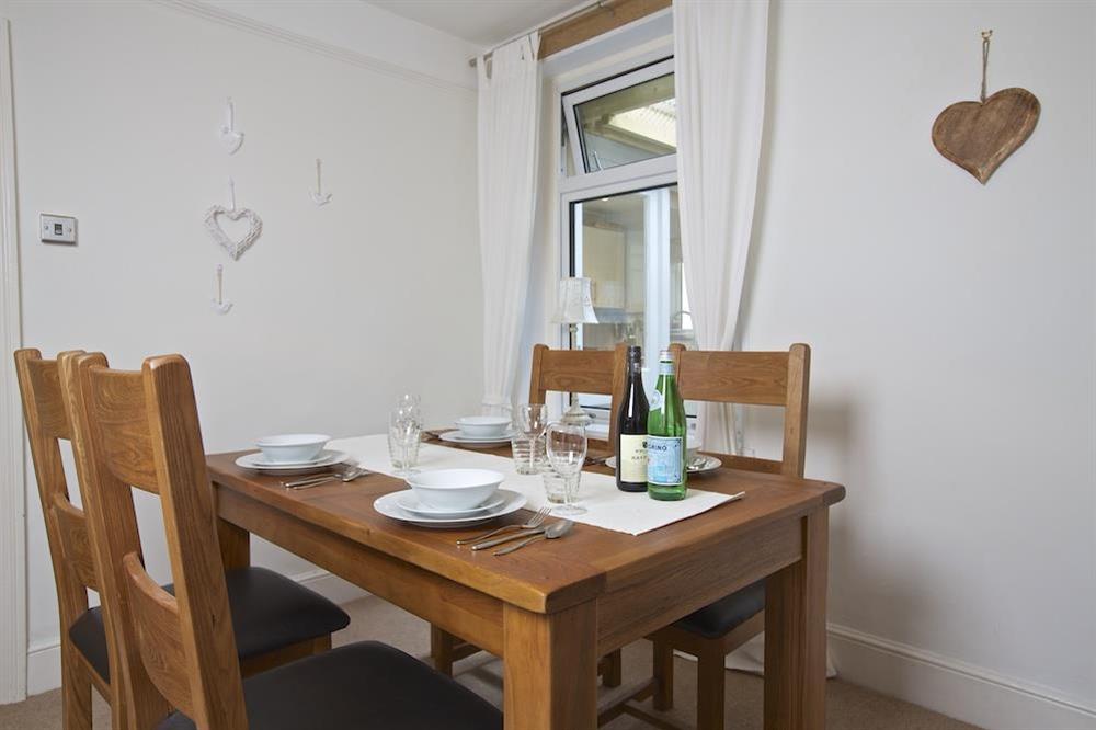 A lovely oak dining table and chairs are a great feature in the dining room at Crew House in Dart Marina, Dartmouth
