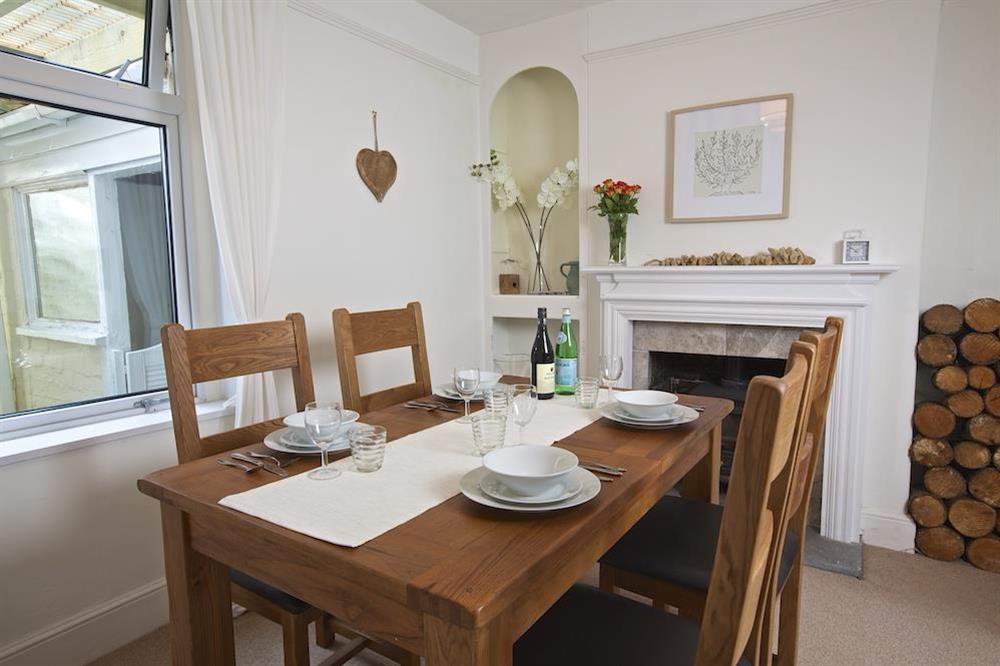 Dining room with seating for four at Crew House in Dart Marina, Dartmouth