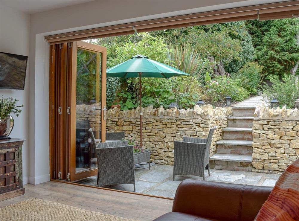 Light and airy living area with bi-fold doors to the garden at Cricket Cottage in Ebrington, Nr Chipping Campden, Glos., Gloucestershire