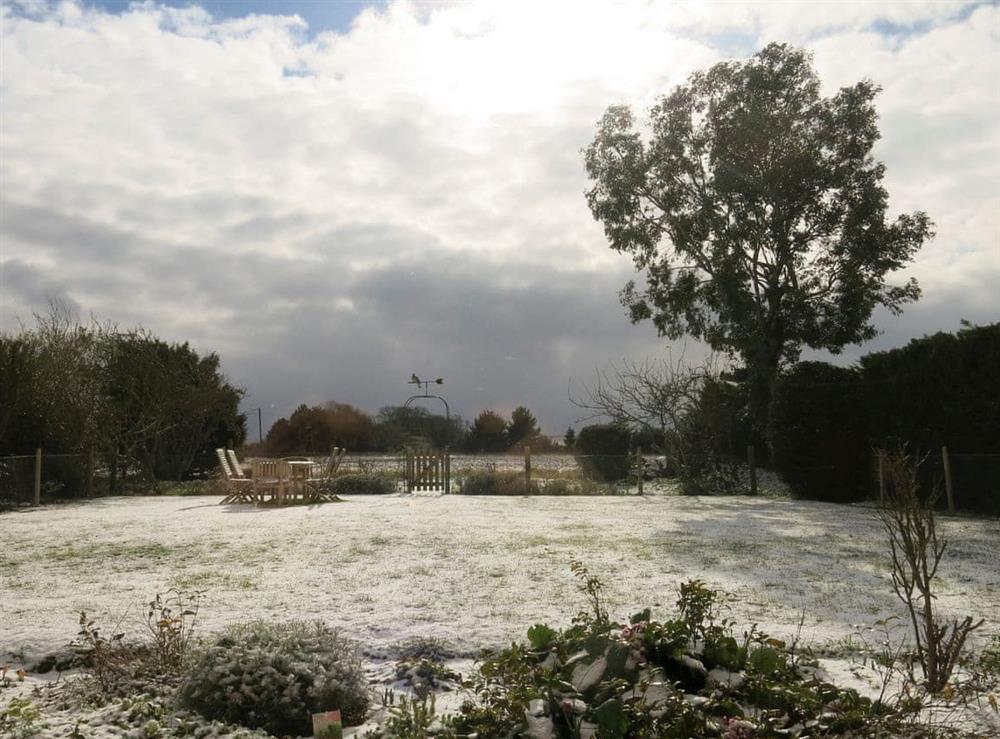 A wintery view over the garden at Crinkum in Titchwell, near Hunstanton, Norfolk