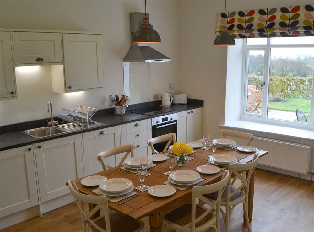 Kitchen with dining area at Croft Cottage in Burradon, near Rothbury, Northumberland