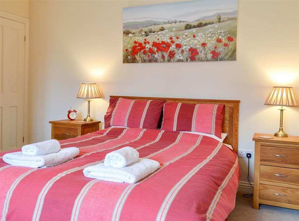 Comfortable bedroom with super kingsize bed at 1 Croft Cottage, 