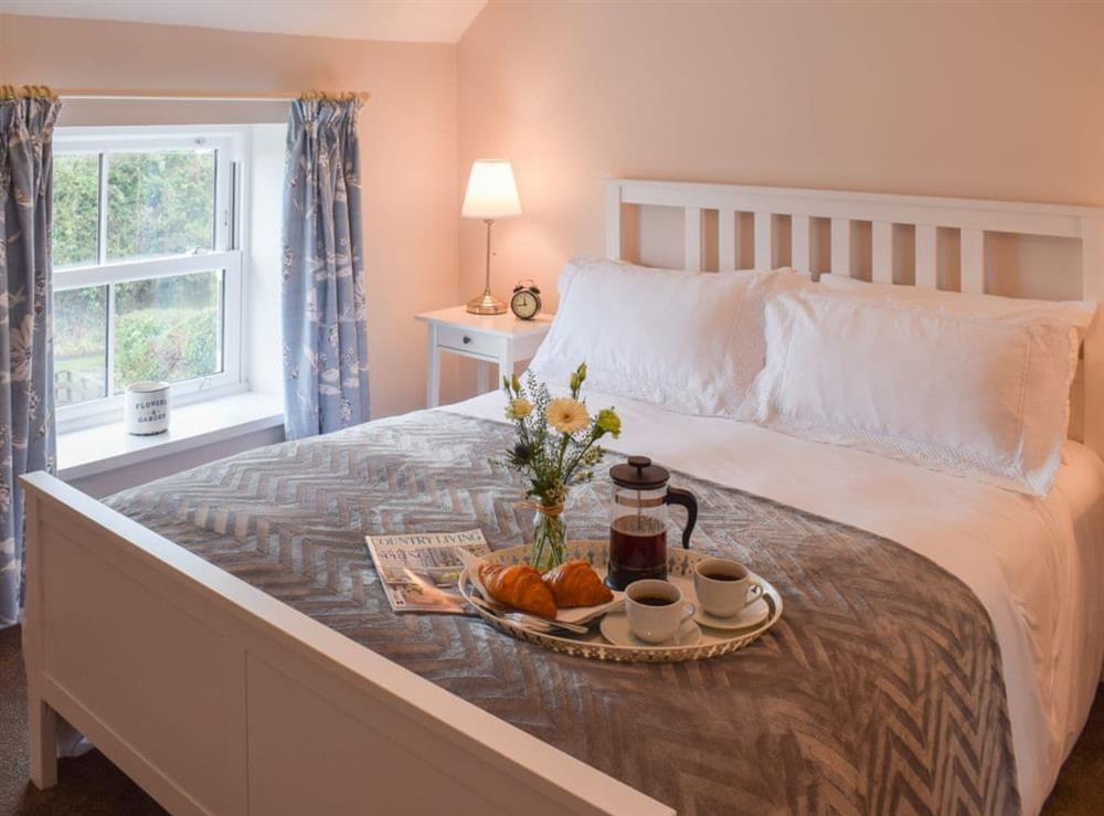 Double bedroom with kingsized double bed at Croft Cottage in Newholm, near Whitby, North Yorkshire