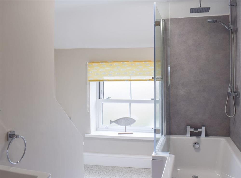 Lovely spacious bathroom with shower over the bath at Croft Cottage in Newholm, near Whitby, North Yorkshire