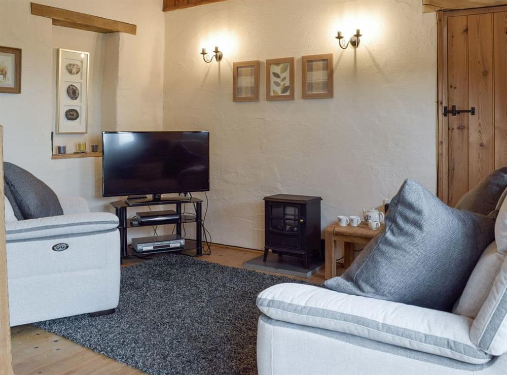 Welcoming living room at Hayloft Cottage, 