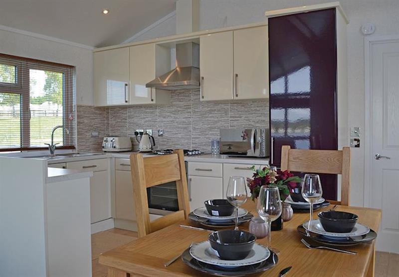 Dining area and kitchen at Croft Farm Water Park in Tewkesbury, Gloucestershire