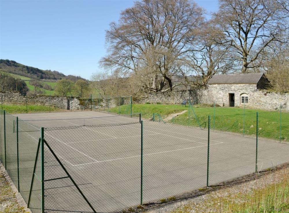 Full size enclosed tennis court