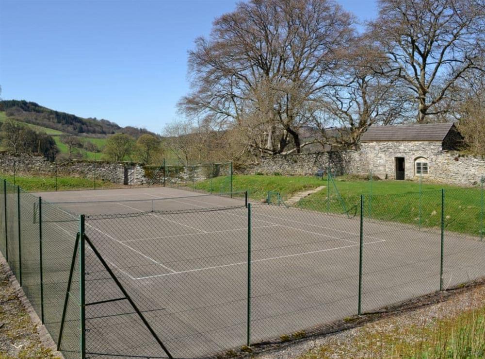 Full sized enclosed tennis court